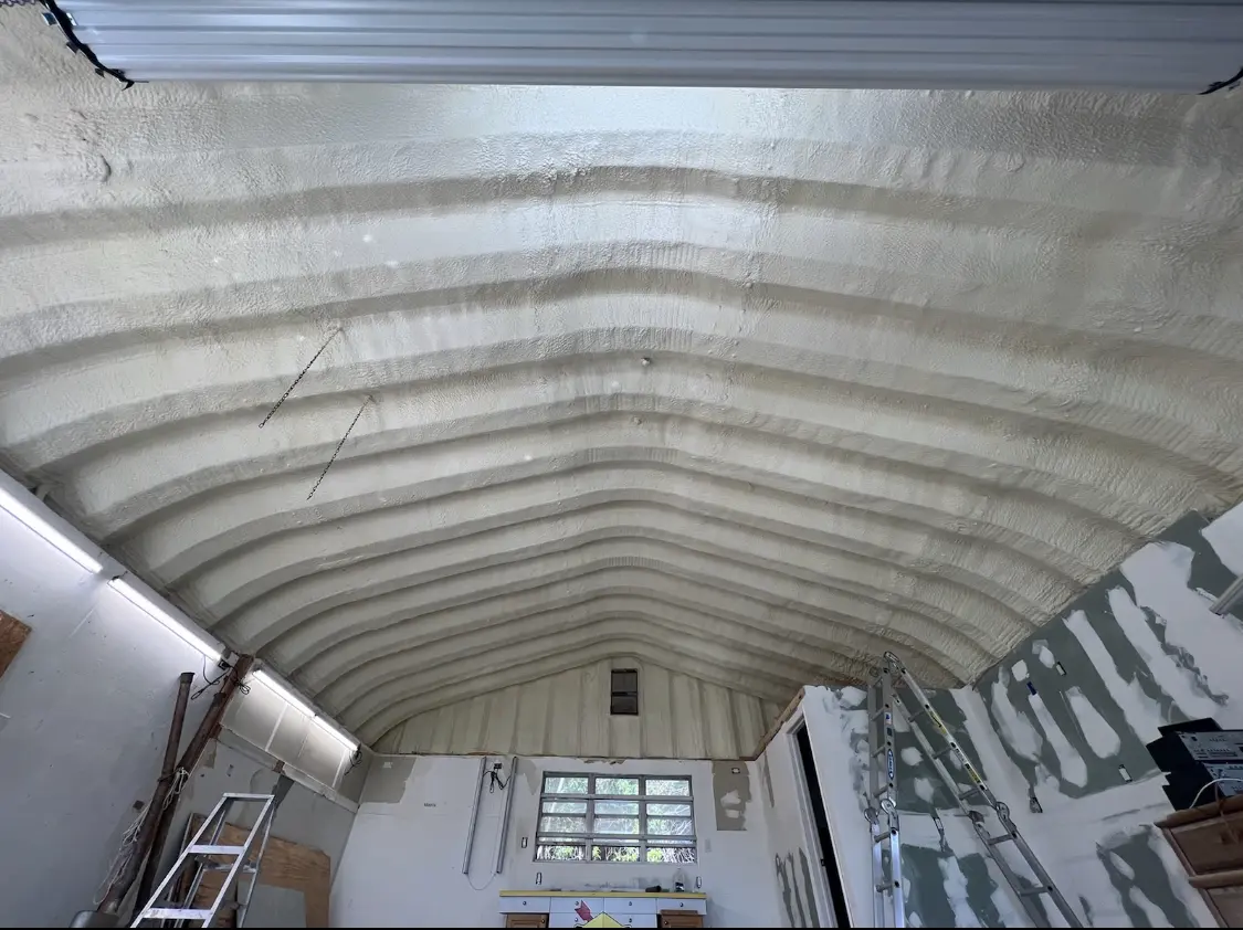 Spray polyurethane foam applied to the underside of a metal roof deck in Oradell